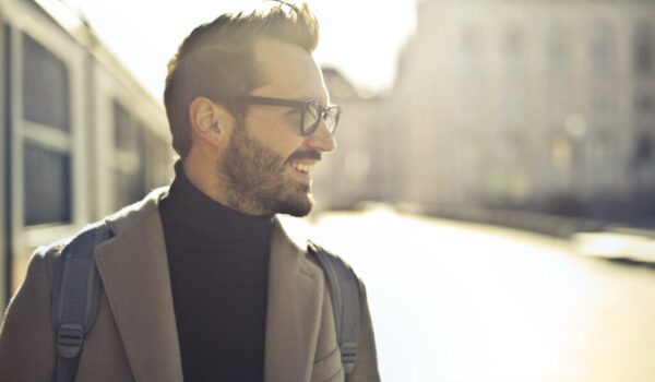 shallow focus photography of man wearing eyeglasses